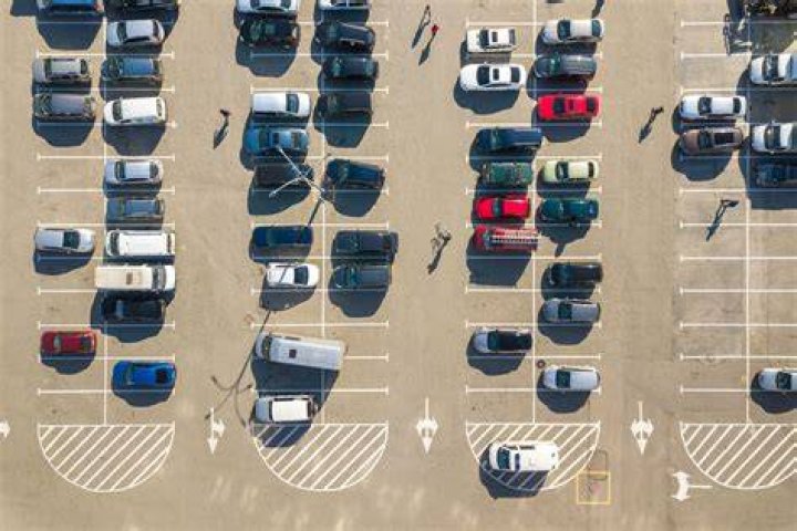 Is it in the parking lot or at the parking lot?