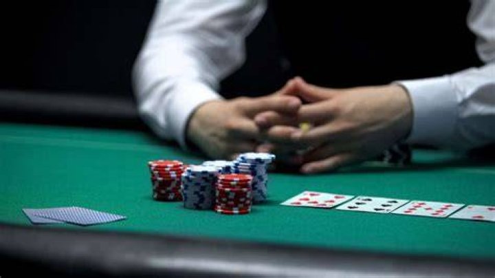 What does taking a rake mean in gambling?