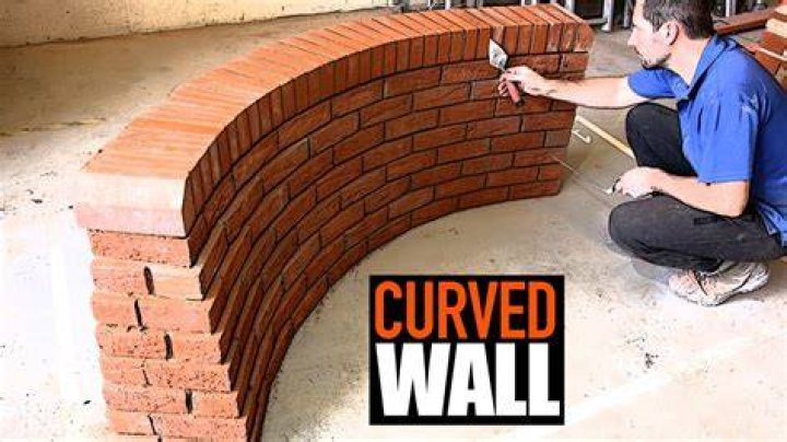 What is a curved brick wall called?