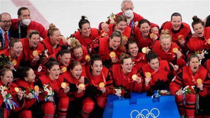 Who is the oldest person to receive a Winter Olympic medal?
