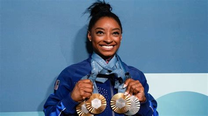 Who is the only person to win gold medals in winter and Summer Olympics?